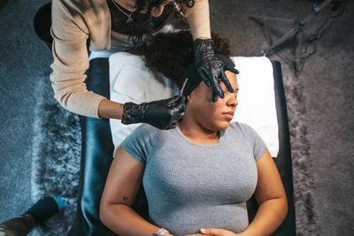 Esthetician performing facial treatment